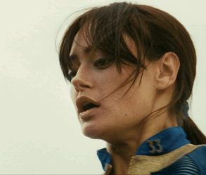 A Close Up Of A Woman 'S Face With The Number 53 On Her Jacket GIF