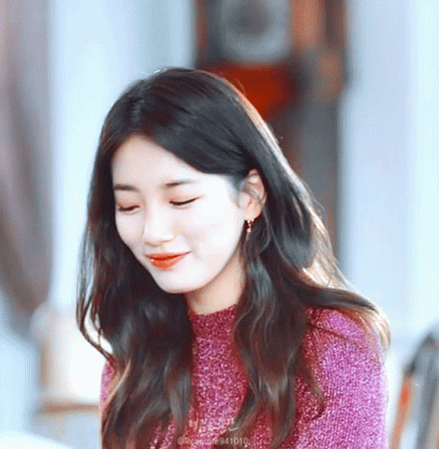 A Close Up Of A Woman 'S Face With The Number 941010 On The Bottom Left GIF