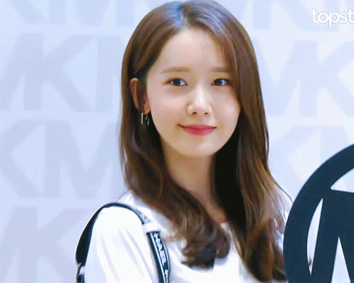 A Close Up Of A Woman 'S Face With The Topst Logo In The Corner GIF