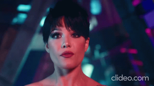A Close Up Of A Woman 'S Face With The Website Clideo.com In The Lower Right Corner GIF