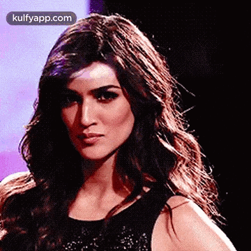 A Close Up Of A Woman 'S Face With The Website Kulfyapp.com In The Corner . GIF