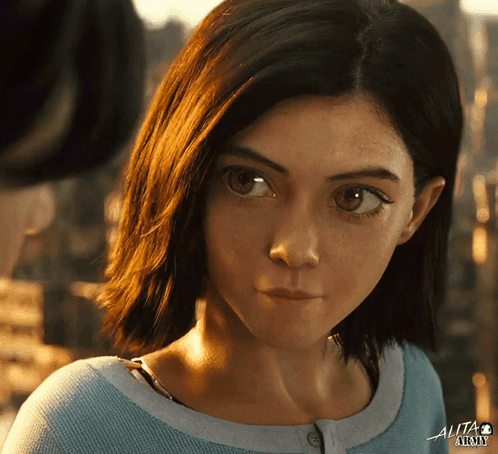 A Close Up Of A Woman 'S Face With The Word Alita At The Top GIF