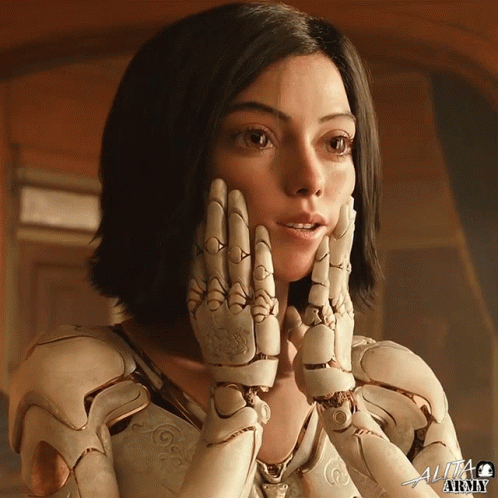 A Close Up Of A Woman 'S Face With The Word Alita At The Top GIF