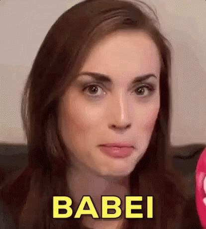 A Close Up Of A Woman 'S Face With The Word Babei In Yellow Letters . GIF