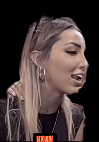A Close Up Of A Woman 'S Face With The Word Bitqueen On The Bottom Left GIF