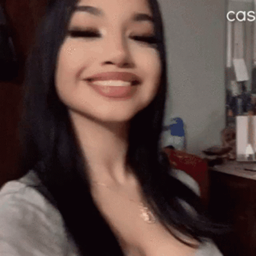 A Close Up Of A Woman 'S Face With The Word Cas On The Bottom Right GIF
