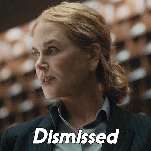 A Close Up Of A Woman 'S Face With The Word Dismissed Above Her GIF