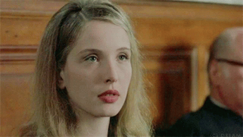 A Close Up Of A Woman 'S Face With The Word Dream On The Bottom Left GIF