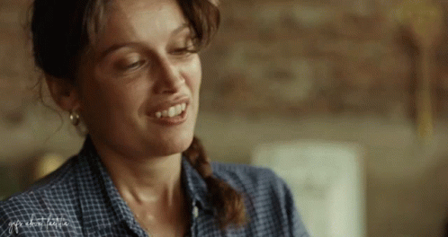 A Close Up Of A Woman 'S Face With The Word Freedom Visible GIF