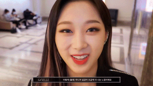 a close up of a woman 's face with the word giselle on the bottom