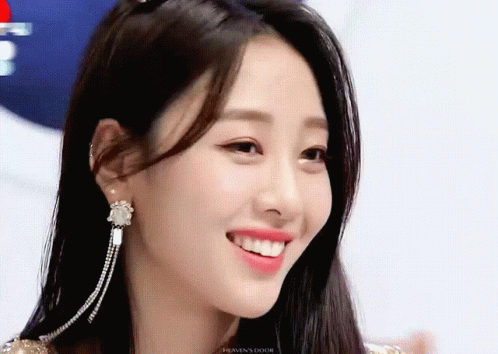 A Close Up Of A Woman 'S Face With The Word Heaven 'S Door On The Bottom GIF