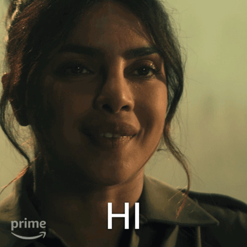 A Close Up Of A Woman 'S Face With The Word Hi In White GIF