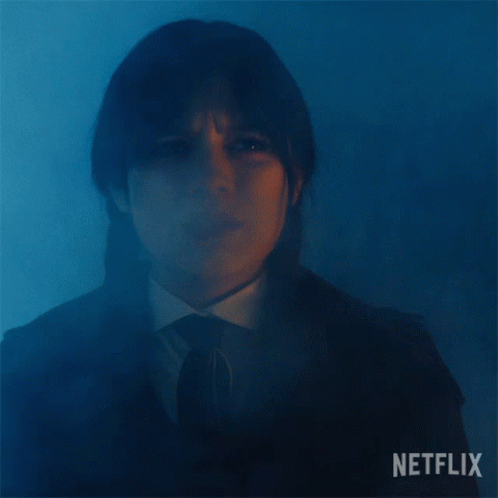 A Close Up Of A Woman 'S Face With The Word Netflix On The Bottom GIF