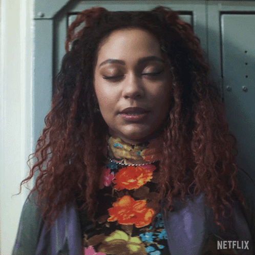 A Close Up Of A Woman 'S Face With The Word Netflix On The Bottom Right GIF