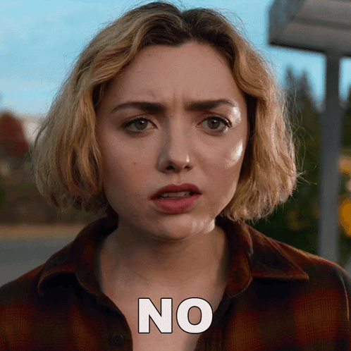 A Close Up Of A Woman 'S Face With The Word No On The Bottom GIF