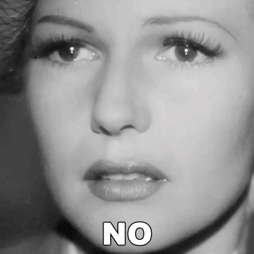 A Close Up Of A Woman 'S Face With The Word No Written Below Her GIF