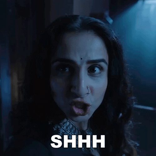 A Close Up Of A Woman 'S Face With The Word Shhh Above Her GIF