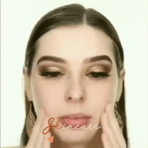 A Close Up Of A Woman 'S Face With The Word Skincare Written In The Corner . GIF