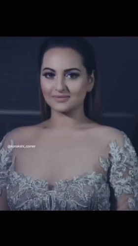 A Close Up Of A Woman 'S Face With The Word Sonakshi Corner On The Bottom GIF
