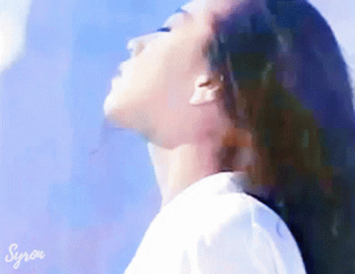 A Close Up Of A Woman 'S Face With The Word Syrow On The Bottom Right GIF