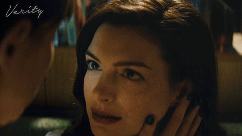 A Close Up Of A Woman 'S Face With The Word Verity On The Bottom Left GIF