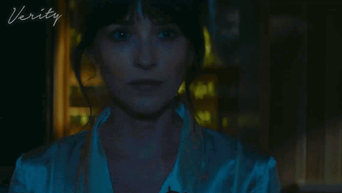 A Close Up Of A Woman 'S Face With The Word Verity On The Bottom Right GIF