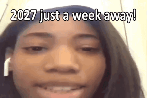 A Close Up Of A Woman 'S Face With The Words 2027 Just A Week Away Written On It GIF
