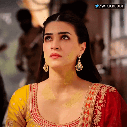 A Close Up Of A Woman 'S Face With The Words 7Wickreddy On The Bottom GIF