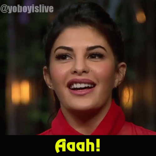 A Close Up Of A Woman 'S Face With The Words Aaah On The Bottom GIF