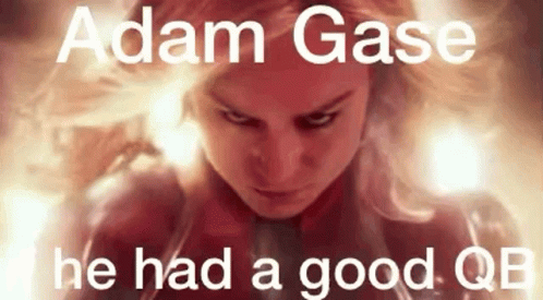 A Close Up Of A Woman 'S Face With The Words Adam Gase He Had A Good Qb On It . GIF