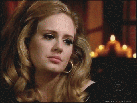 A Close Up Of A Woman 'S Face With The Words Adelk-Theoneandonly On The Bottom GIF