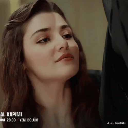 A Close Up Of A Woman 'S Face With The Words " Al Kapimi " On The Bottom Right GIF