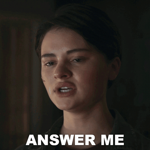 A Close Up Of A Woman 'S Face With The Words Answer Me Below It GIF