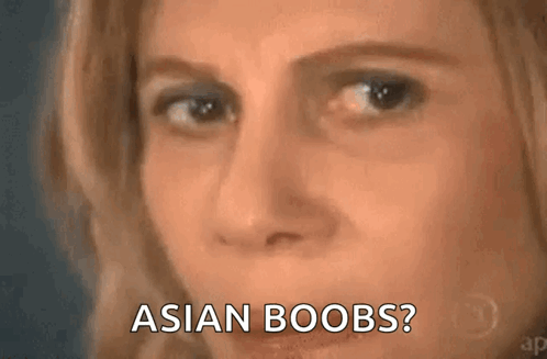 A Close Up Of A Woman 'S Face With The Words Asian Boobs . GIF