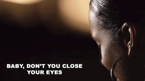 A Close Up Of A Woman 'S Face With The Words Baby , Don 'T You Close Your Eyes Written Below Her GIF