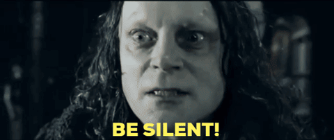 a close up of a woman 's face with the words be silent in yellow letters