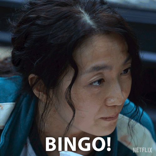 A Close Up Of A Woman 'S Face With The Words Bingo Written On It GIF