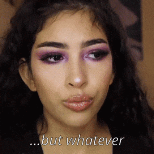 A Close Up Of A Woman 'S Face With The Words But Whatever Above Her GIF