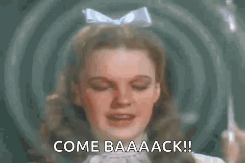A Close Up Of A Woman 'S Face With The Words `` Come Baaaack '' Written Above Her . GIF