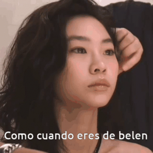 A Close Up Of A Woman 'S Face With The Words Como Cuando Eres De Belen GIF