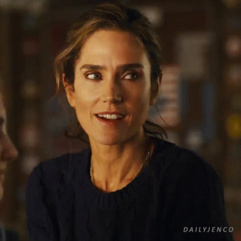 A Close Up Of A Woman 'S Face With The Words Dailyjenco On The Bottom Right GIF