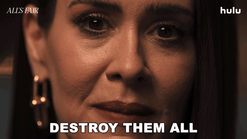 A Close Up Of A Woman 'S Face With The Words " Destroy Them All " On The Bottom GIF
