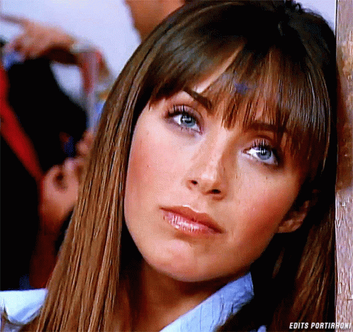A Close Up Of A Woman 'S Face With The Words Edits Portirroni On The Bottom GIF