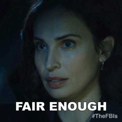 A Close Up Of A Woman 'S Face With The Words Fair Enough Below Her GIF