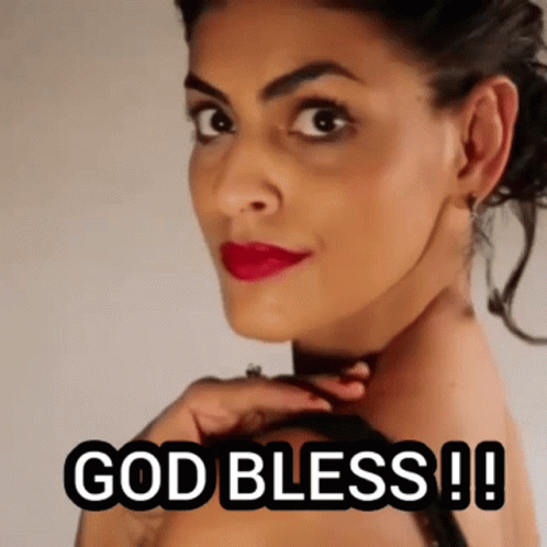 A Close Up Of A Woman 'S Face With The Words `` God Bless ! '' GIF