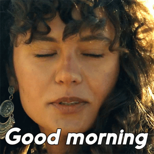 A Close Up Of A Woman 'S Face With The Words Good Morning Below It GIF