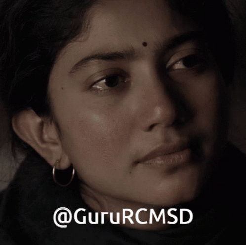 A Close Up Of A Woman 'S Face With The Words Gururcmsd On The Bottom Right GIF