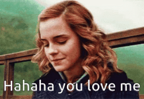 A Close Up Of A Woman 'S Face With The Words ' Hahahaha You Love Me ' On The Bottom . GIF