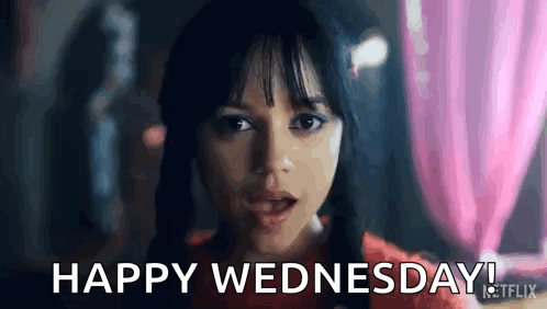 a close up of a woman 's face with the words `` happy wednesday '' written on it .