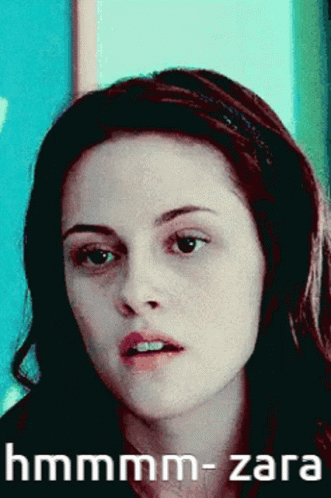 A Close Up Of A Woman 'S Face With The Words Hmmmm-Zara Written Below Her GIF